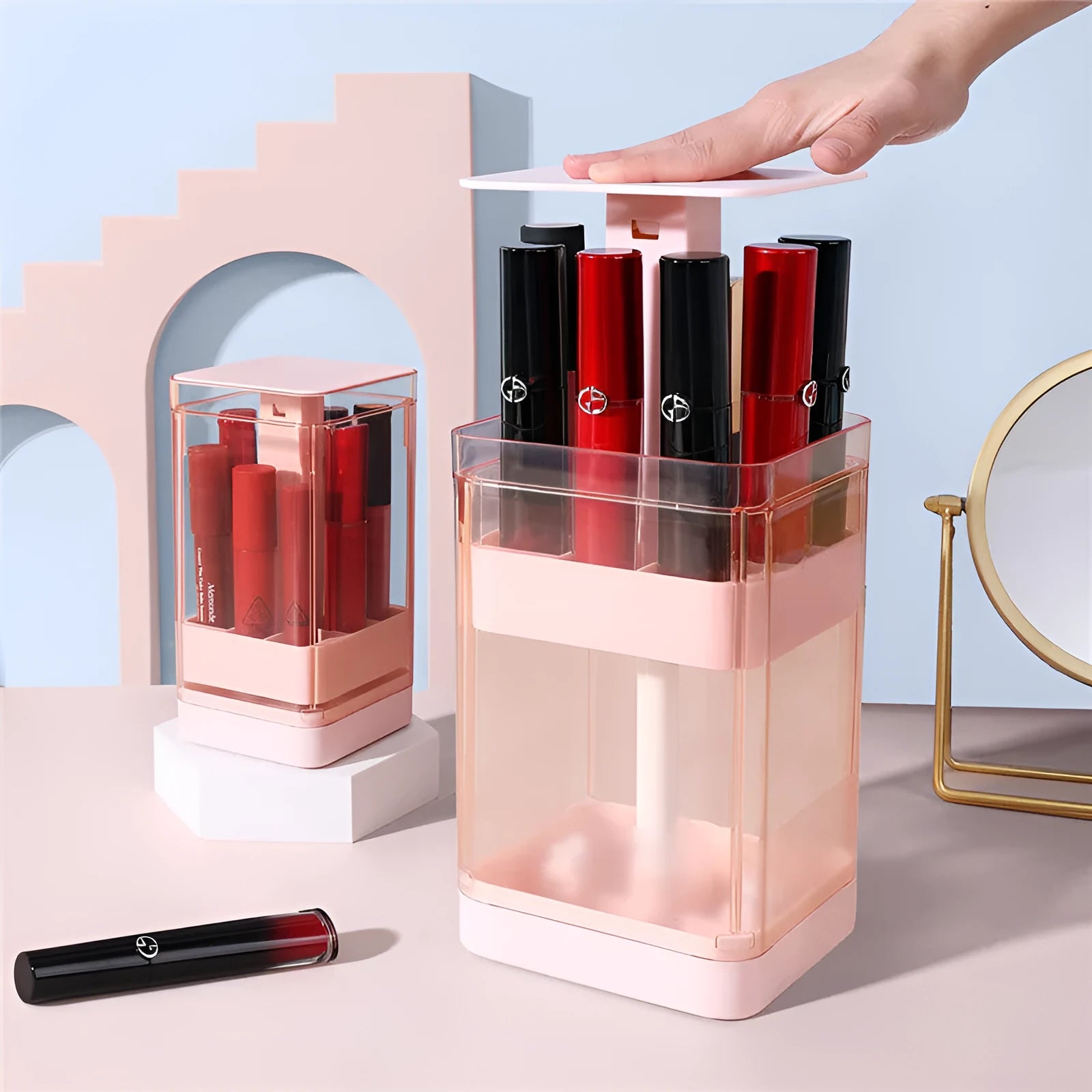Pink and white press-lift lipstick storage boxes showing 8-grid and 12-grid compartments.