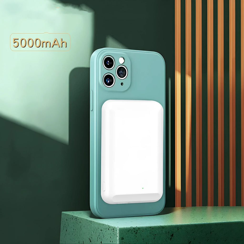A black magnetic wireless power bank with a 5000mAh capacity, shown next to a smartphone.
