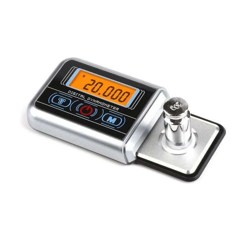 Small digital electronic scale on a table showing 0.005g accuracy.