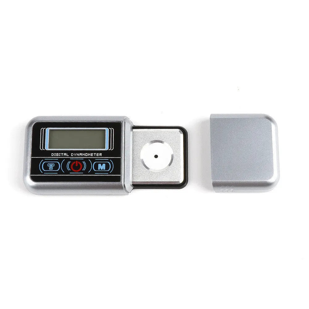 Small digital electronic scale on a table showing 0.005g accuracy.
