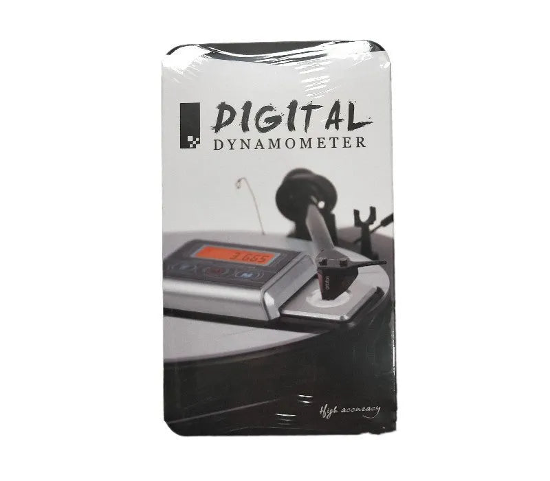 Small digital electronic scale on a table showing 0.005g accuracy.
