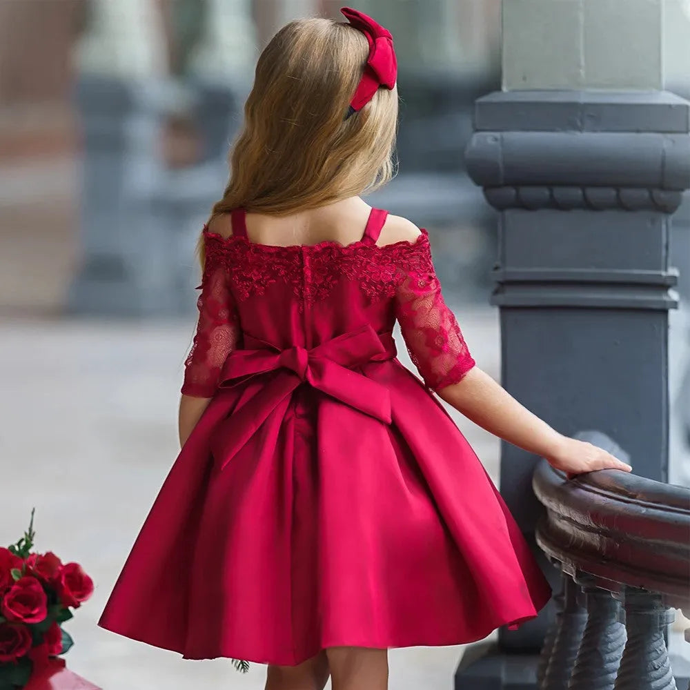 Girls lace-trimmed dress in simple style shown in dark red, pink, red, white and green colour options.