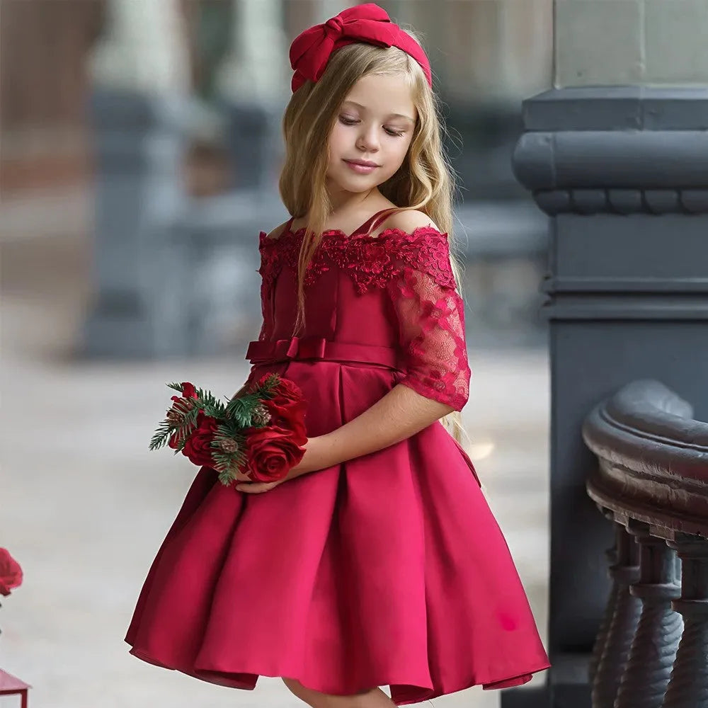 Girls lace-trimmed dress in simple style shown in dark red, pink, red, white and green colour options.