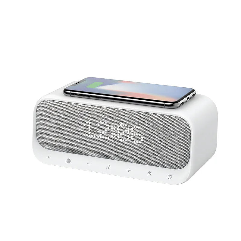 White Anker Soundcore Bluetooth speaker with integrated display and wireless charging surface.