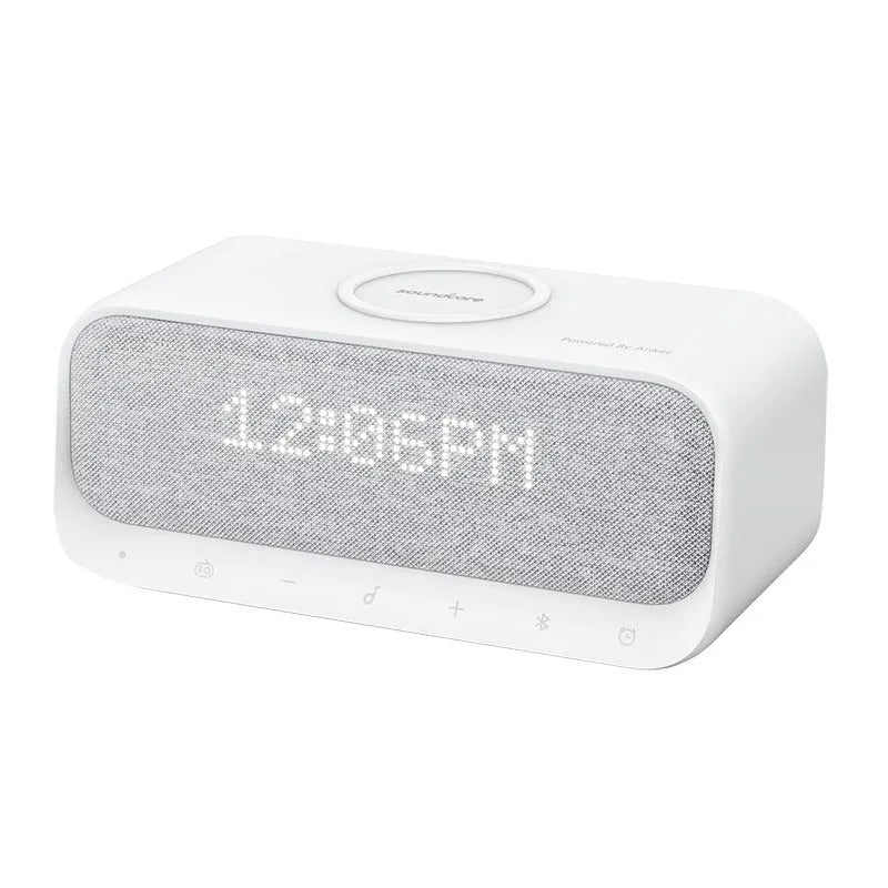 White Anker Soundcore Bluetooth speaker with integrated display and wireless charging surface.