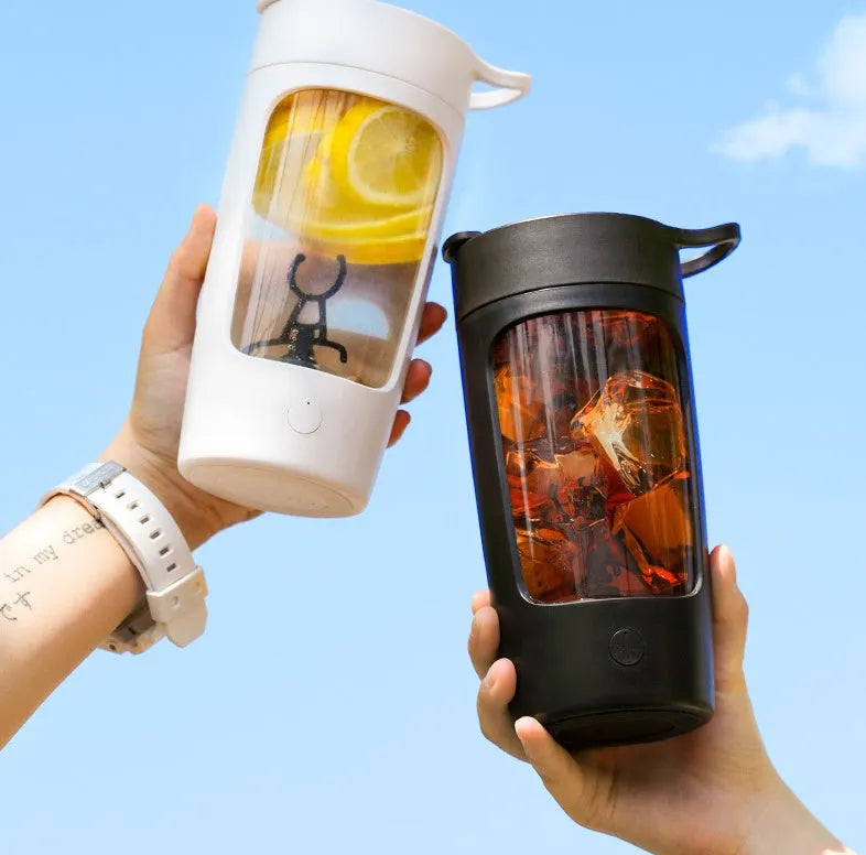 Portable rechargeable blender cup in white, showing cup and motor base, with 650ml capacity mark