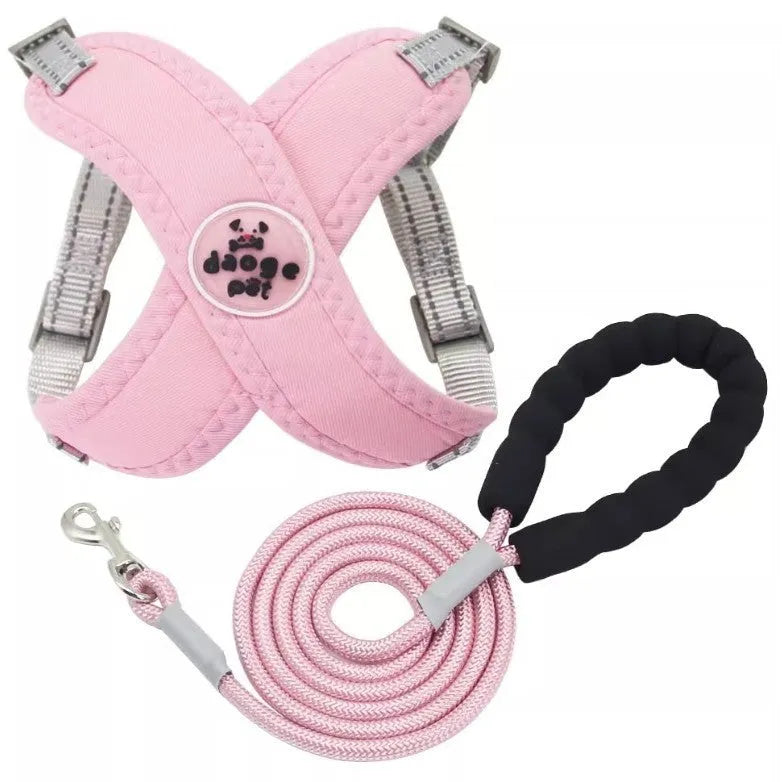 Blue polyester dog vest harness with an attached hand-held rope for walking.