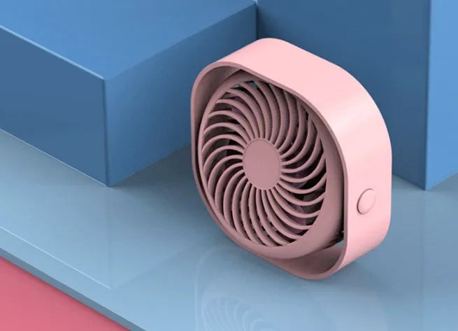 USB desk fan with rotating head in modern alarm clock style on a desk.