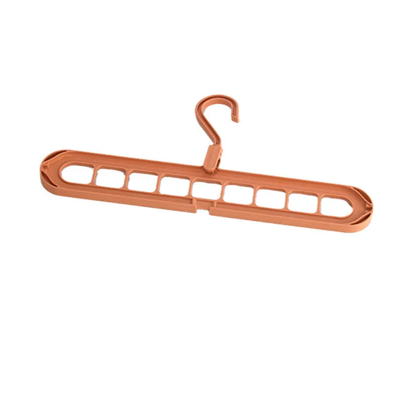 Multifunctional plastic nine-hole folding hanger for trousers, shown in beige, blue, green, pink, and grey colour options.