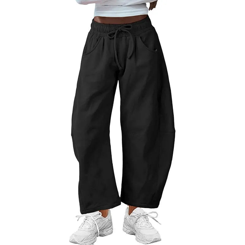 Loose cropped cotton sweatpants with elastic drawstring waist and side pockets in multiple colour options
