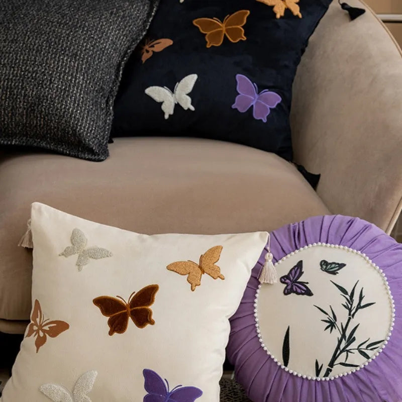 Square beige cushion with embroidered black butterfly in Chinese style pattern