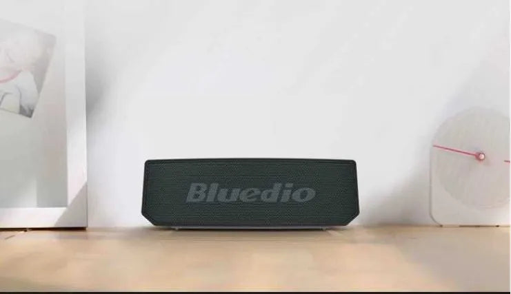 Black rectangular BS-6 Bluetooth speaker showing front speaker grill and control buttons