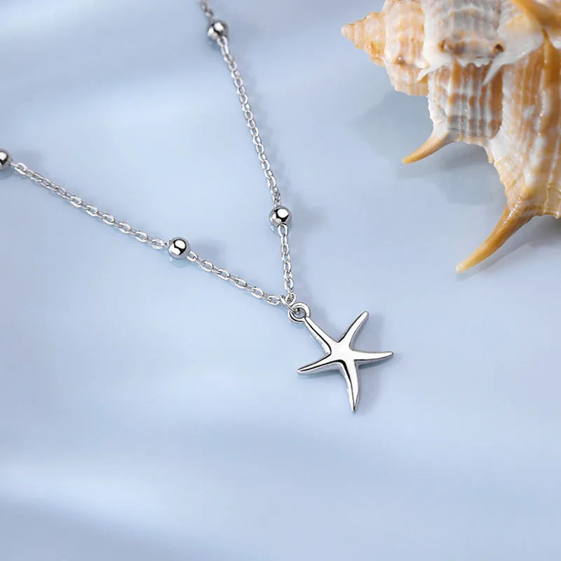 Women's sterling silver anklet with starfish charm beads on adjustable chain