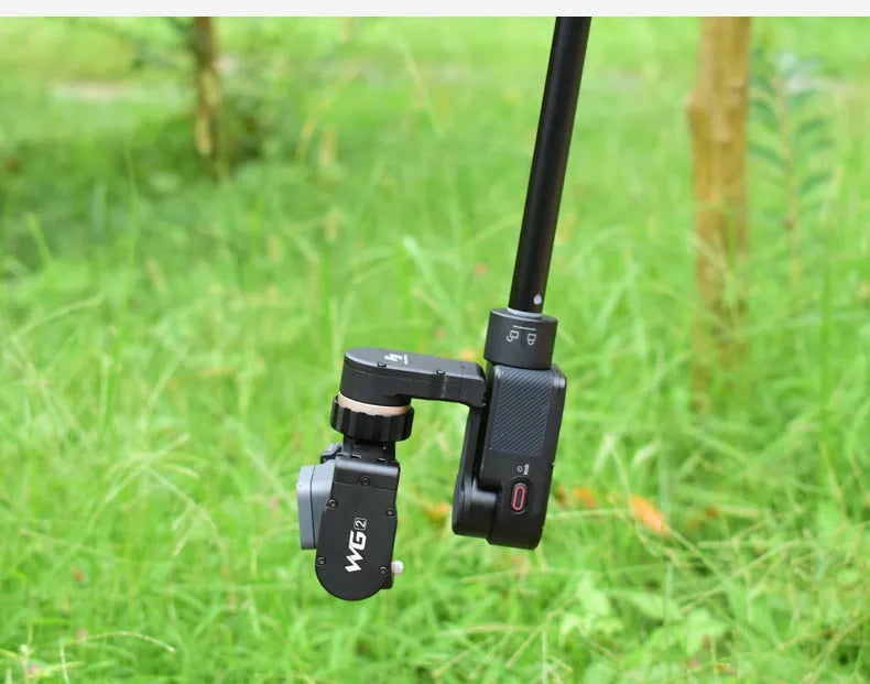 Black retractable selfie stick with adjustable phone mount extended to full length