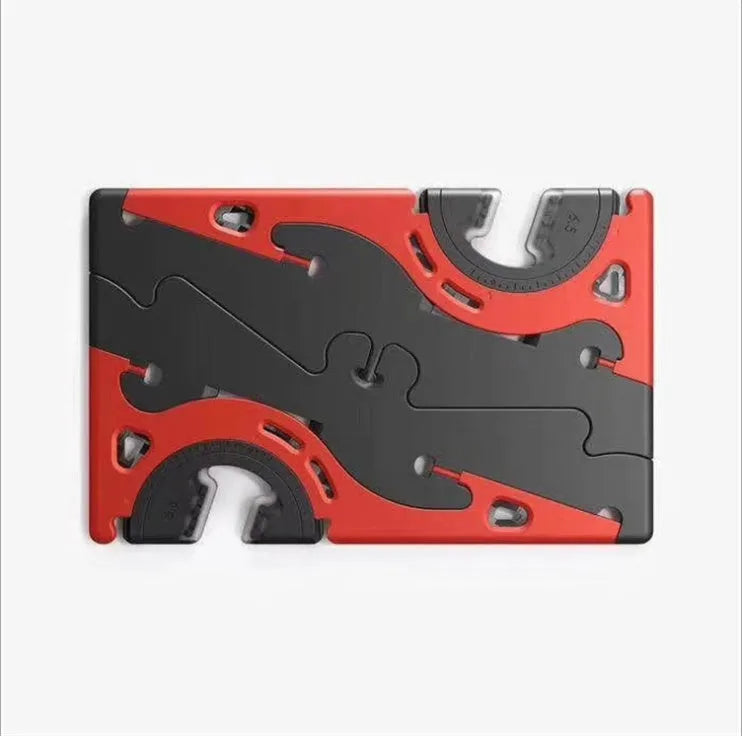 Black plastic card-type mobile phone holder propping a smartphone on a desktop
