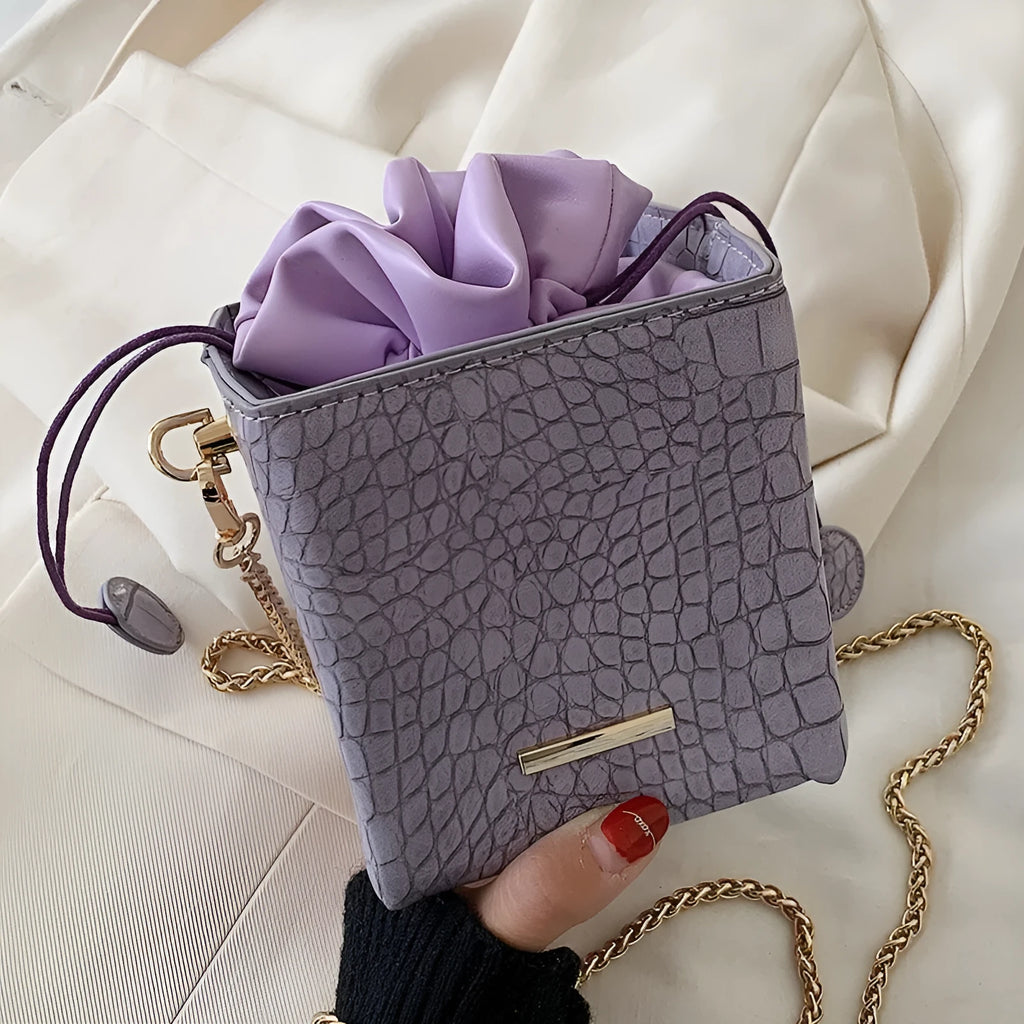 Women's small one shoulder messenger bag with chain strap in bucket style design