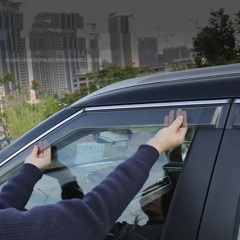 2023 Outlander window deflectors in black warrior style, mounted on vehicle exterior