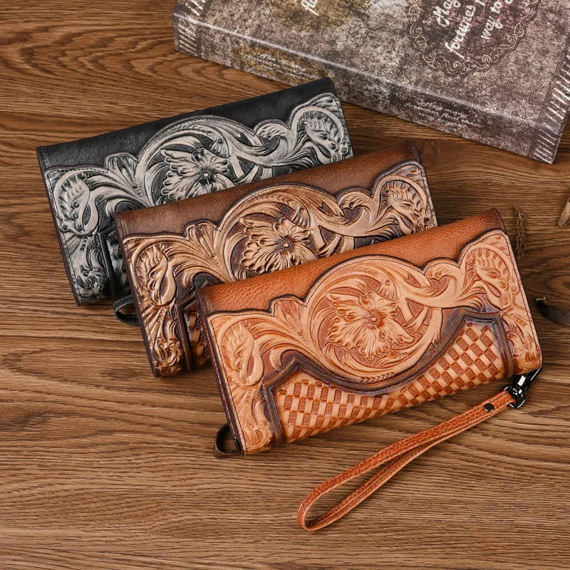 Women's brown tri-fold leather wallet with embossed Chinese floral pattern showing multiple compartments