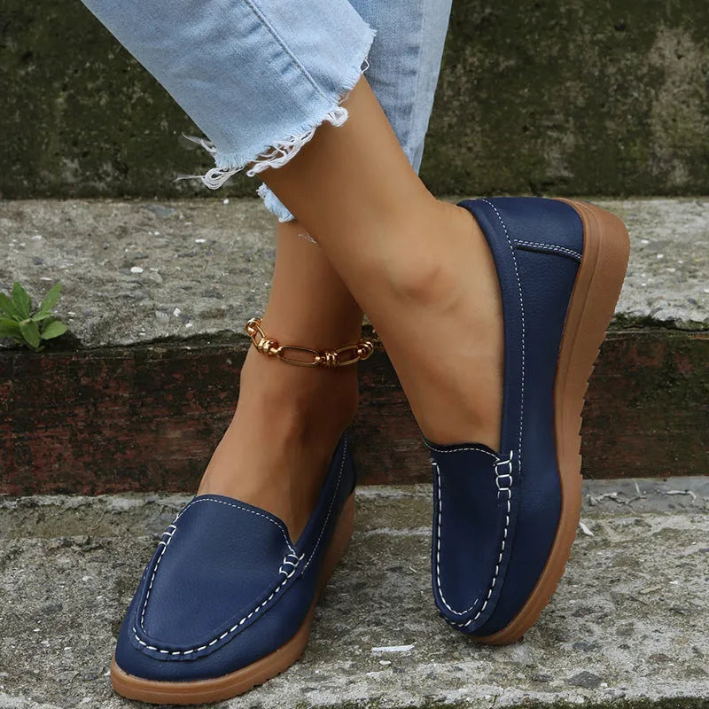 Women's flat loafer shoes in PU leather with a round toe and rubber sole, shown in multiple colours.