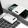 White or black portable power bank with multiple USB ports showing compact 92x63x23mm dimensions
