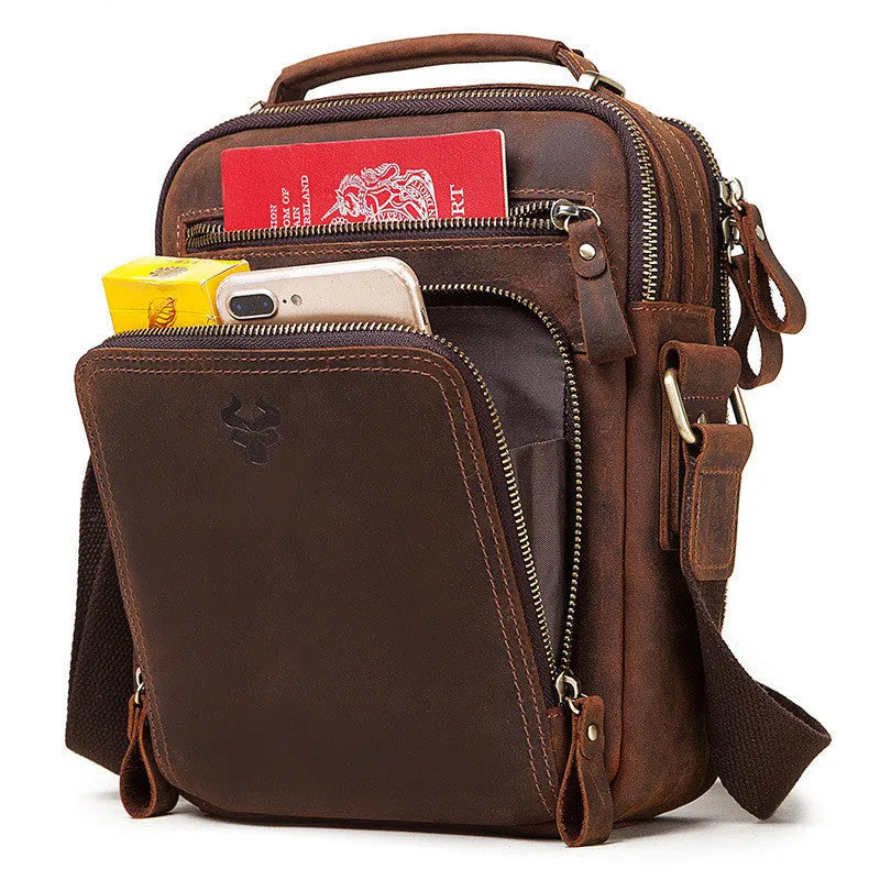 Men's brown crazy horse leather crossbody bag with sewing line detail and single shoulder strap.
