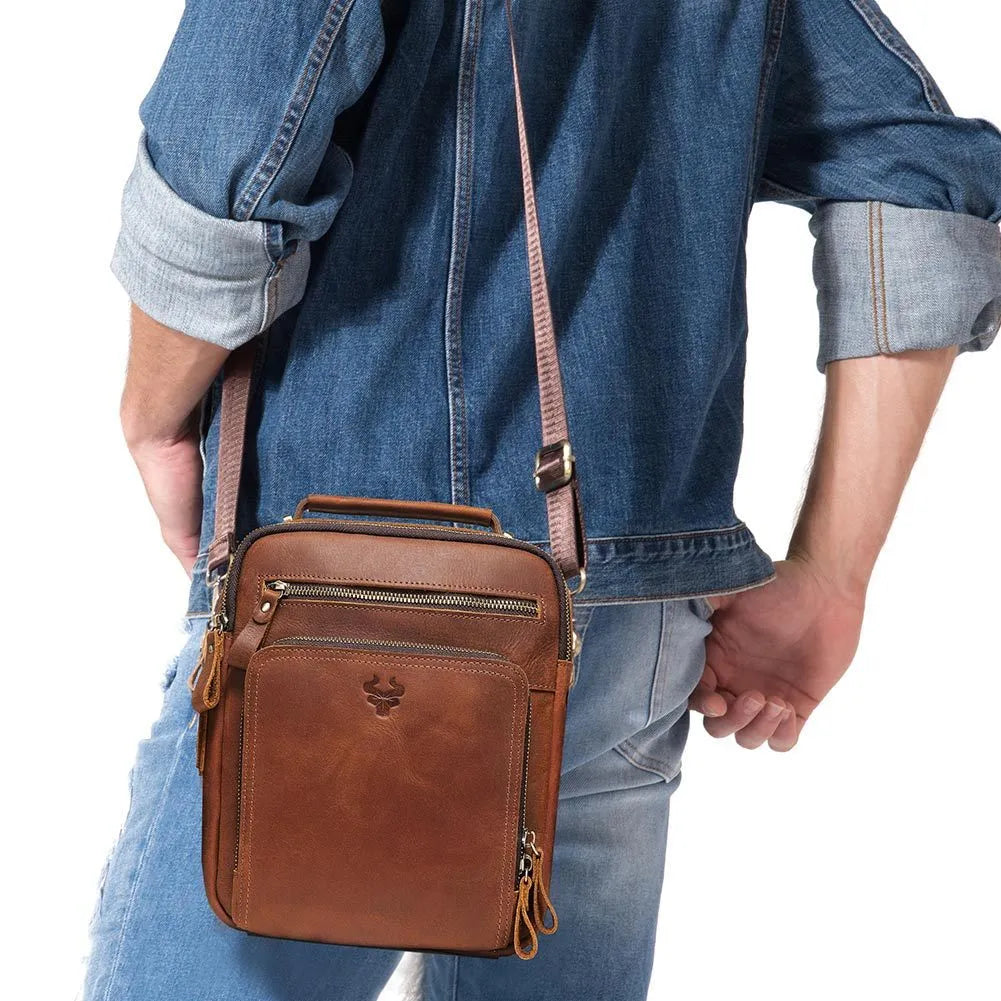 Men's brown crazy horse leather crossbody bag with sewing line detail and single shoulder strap.