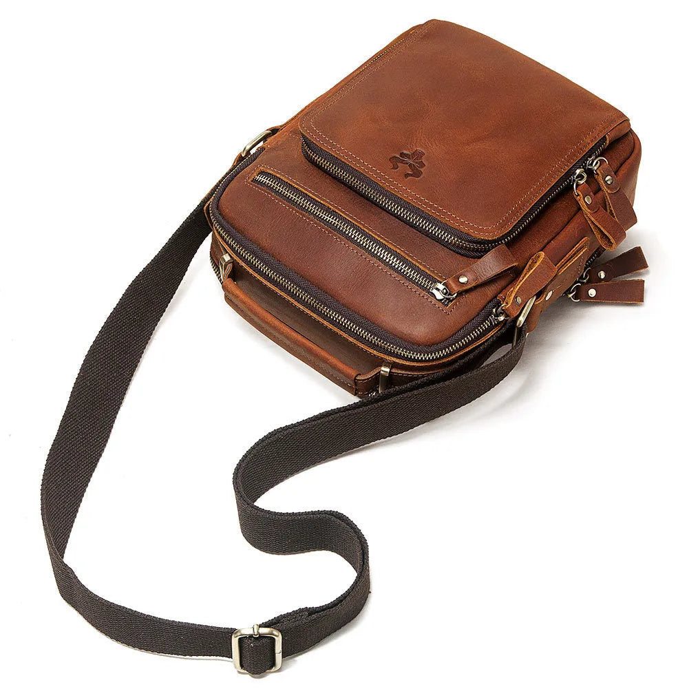 Men's brown crazy horse leather crossbody bag with sewing line detail and single shoulder strap.