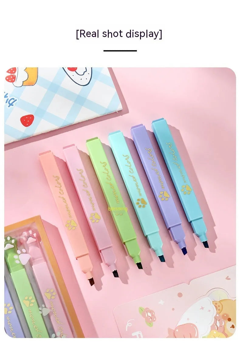 Cat's Paw fluorescent marking pen set showing six pens with oblique heads in different colours, packaged in a box.