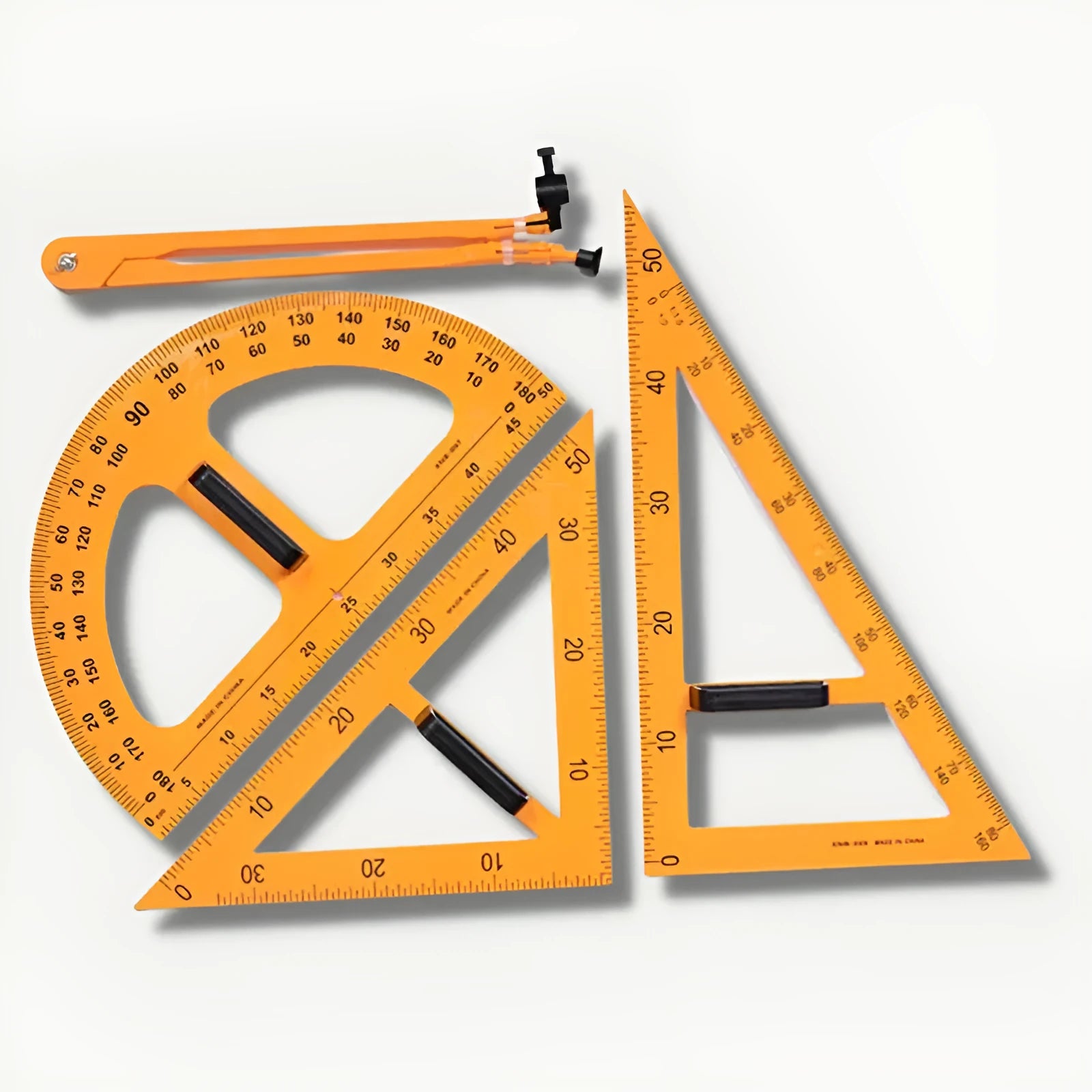 Orange and black mathematics teaching tools set with triangle rulers, protractor, and chalk compass