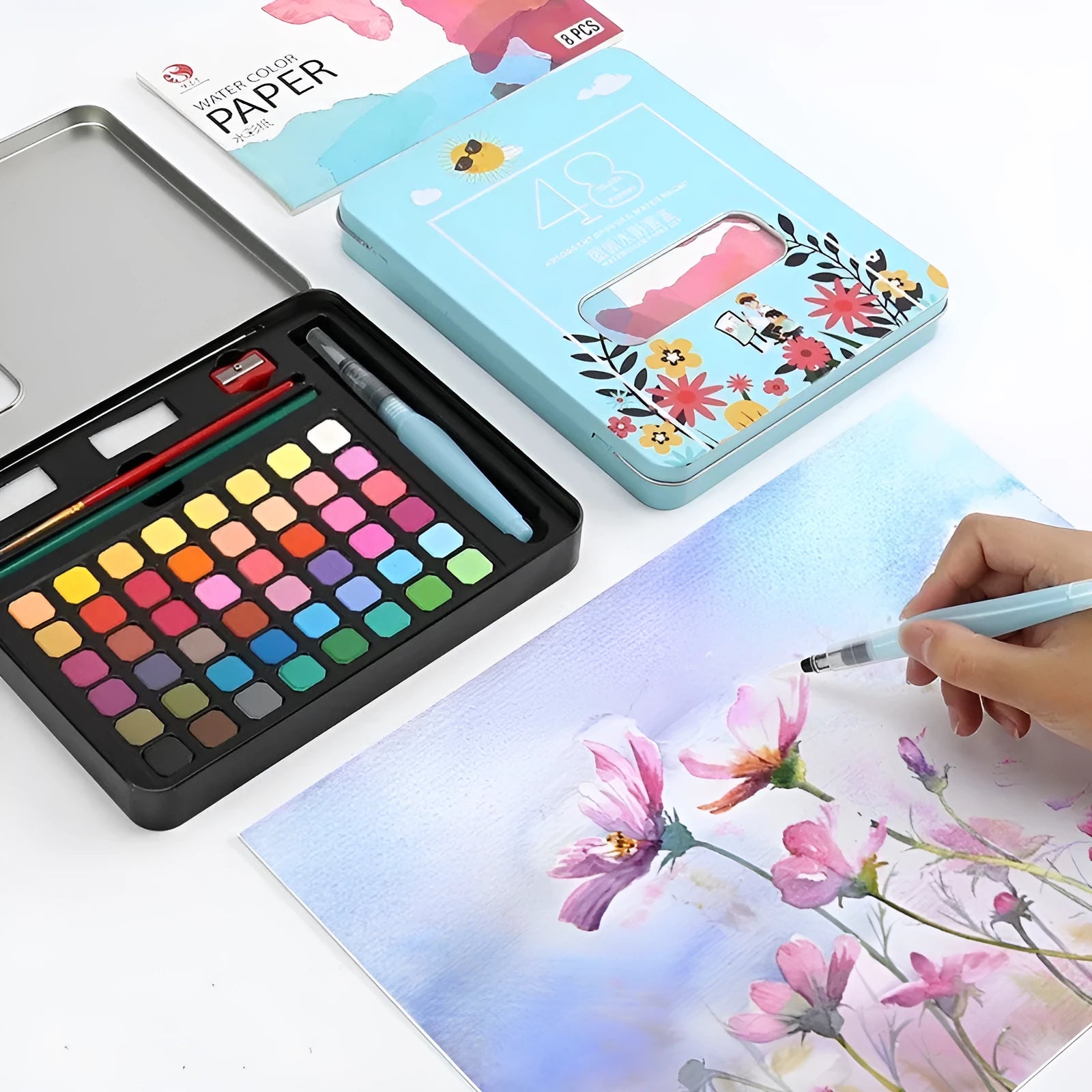 Boxed set of 48 solid watercolour paint tablets including Black Knight, Girl Pink, and Sunshine Blue colours.
