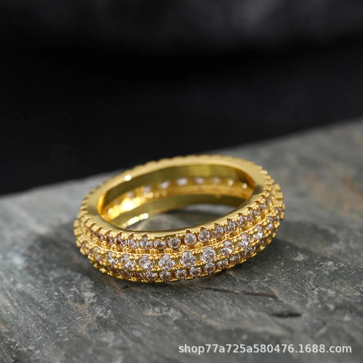 Geometric copper ring with triangular zircon stone, shown in white gold, yellow gold, and white and black finish options.
