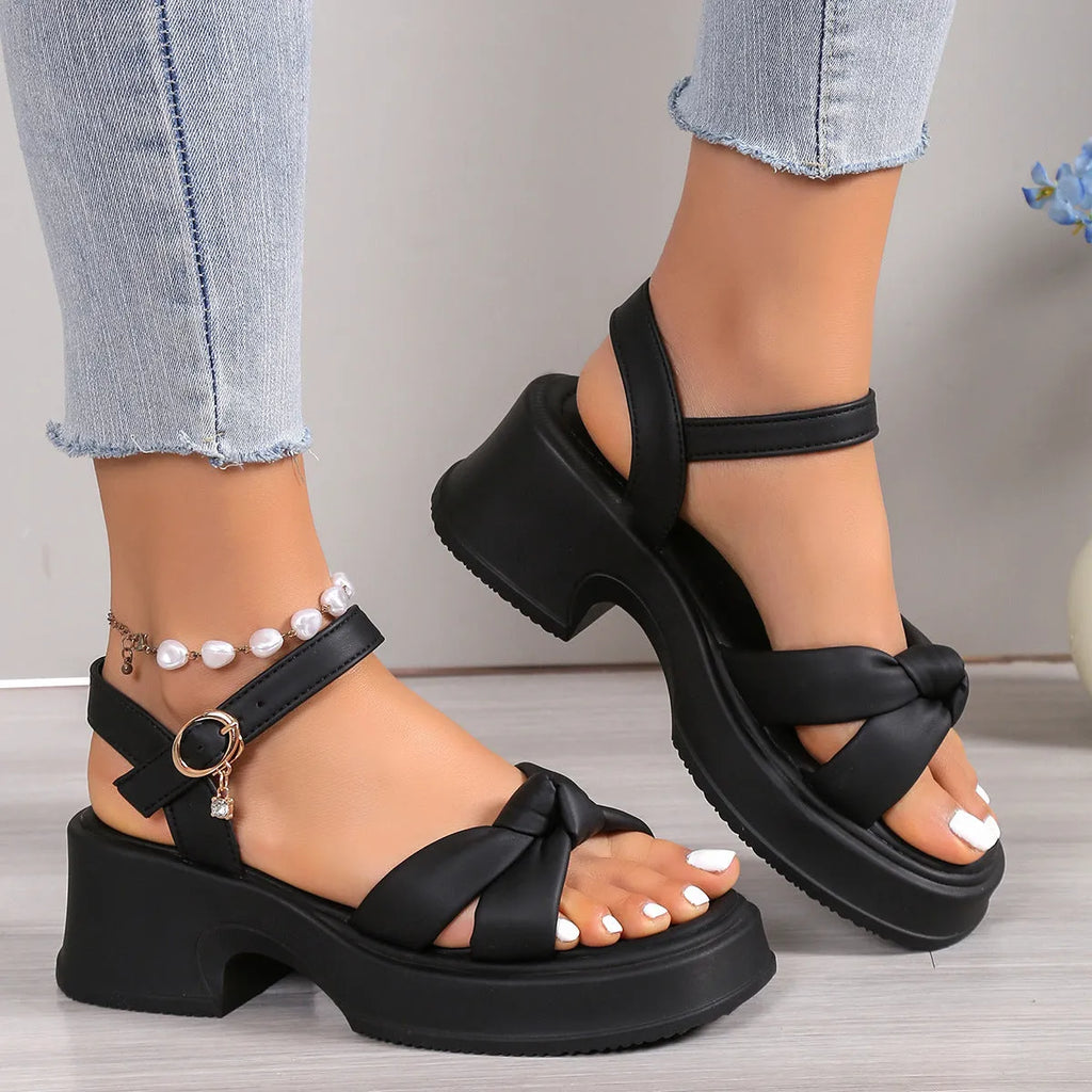 Black thick-heel high heel slippers with button closure and round toe design