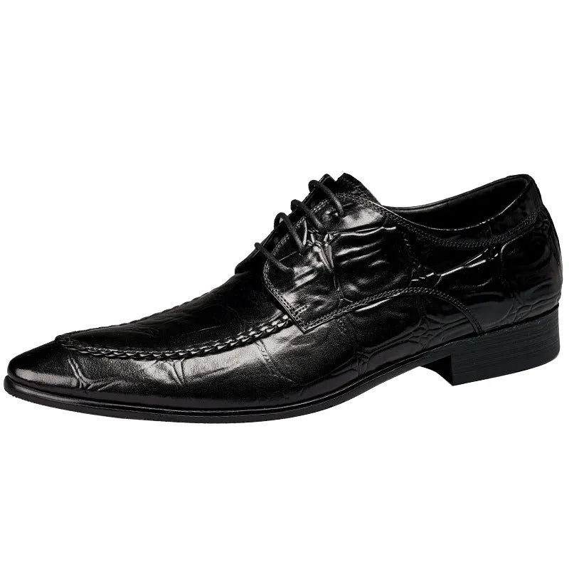 Men's brown leather loafers with a silver horse bit buckle on a rubber sole.