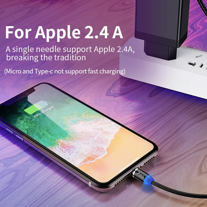 Black magnetic data cable with detachable USB-C and Lightning heads on a table.