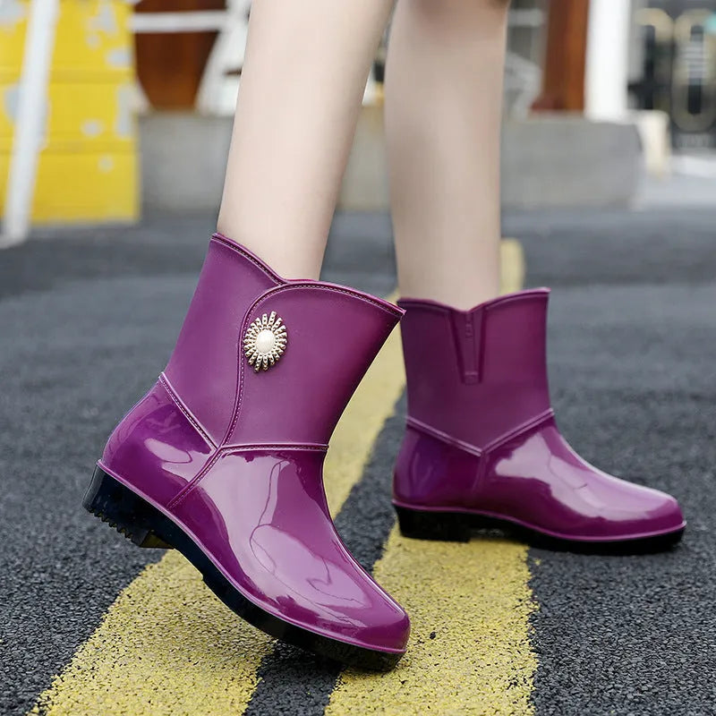 Women's purple PVC rain boots with non-slip sole and middle tube design