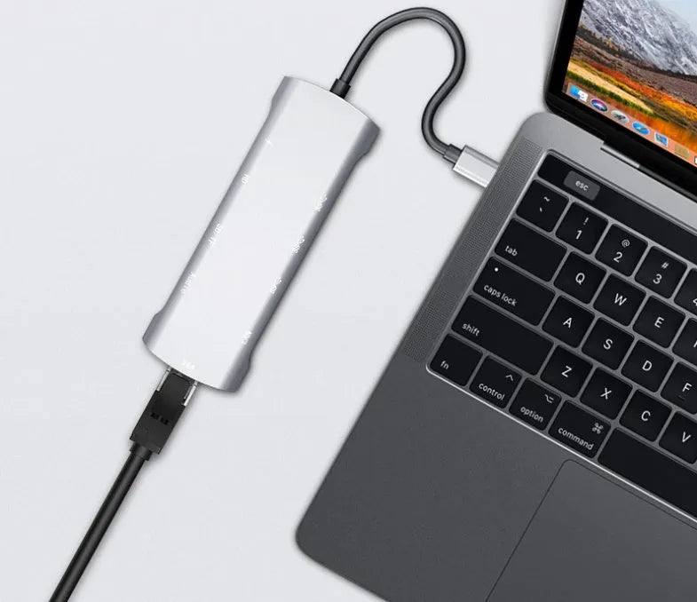 Grey USB-C docking station with HDMI, VGA, USB 3.0 and charging ports