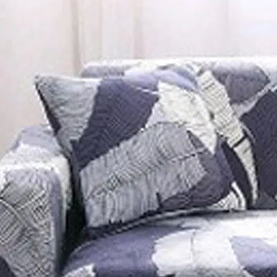 Printed stretch sofa cover with geometric pattern on three-seater sofa