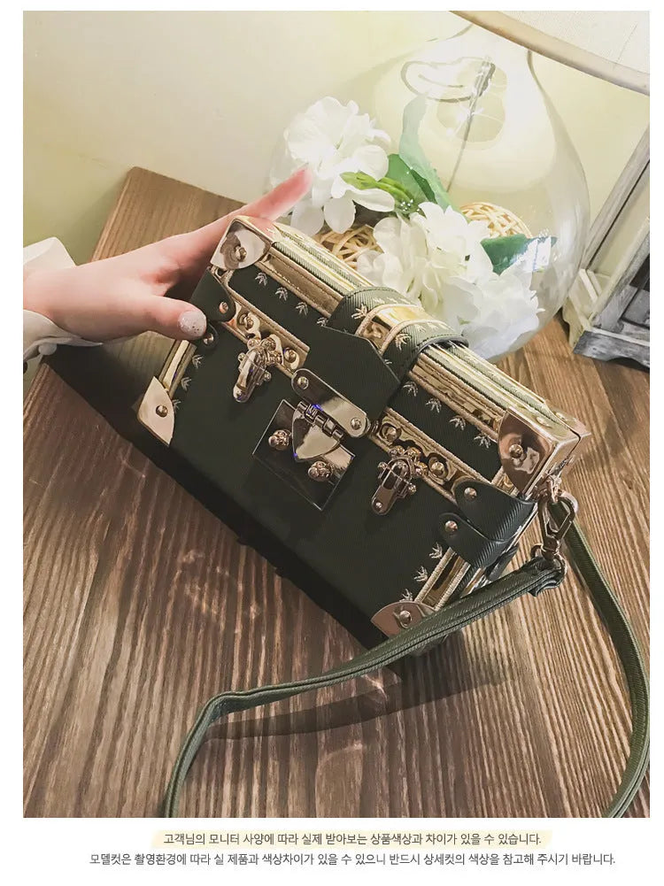 Women's hard black PU leather shoulder bag with flap closure and rivet decoration