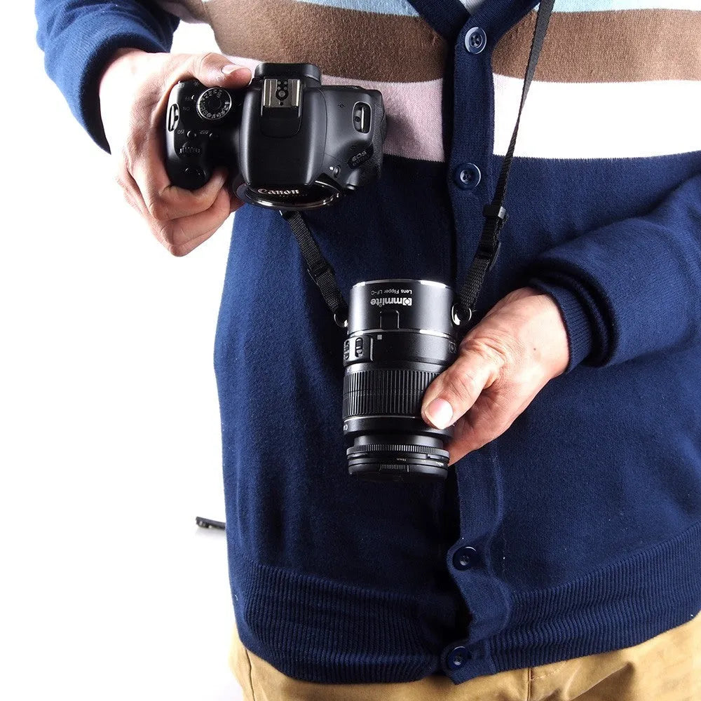 Aluminium alloy Nikon E-Mount lens flipper with stainless steel buckle and cotton shoulder strap.