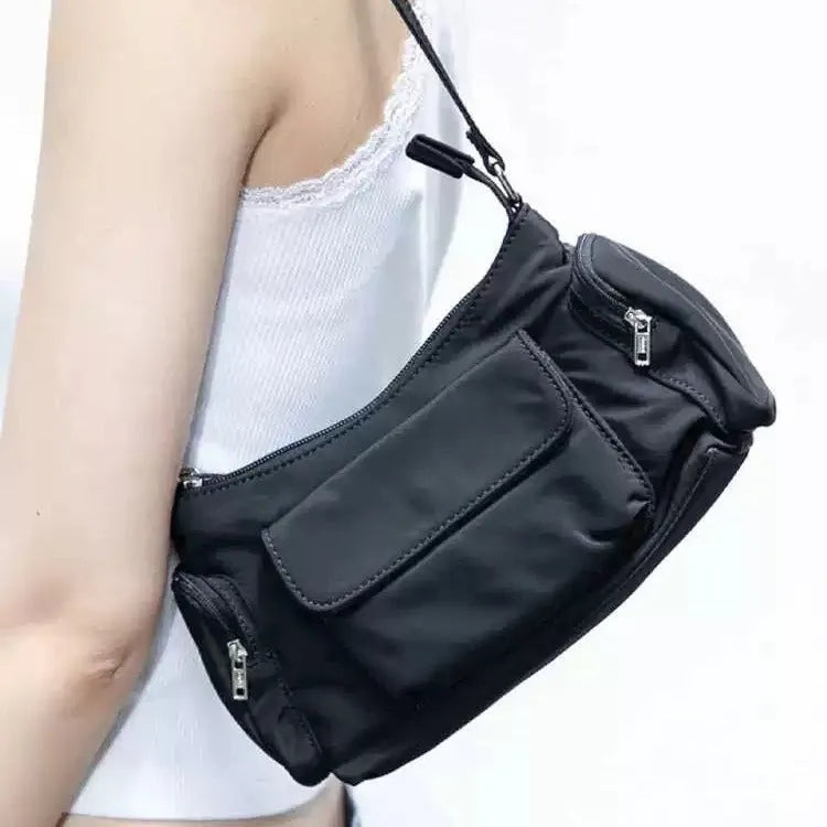 Black PU lightweight shoulder bag with two pockets and side line detail
