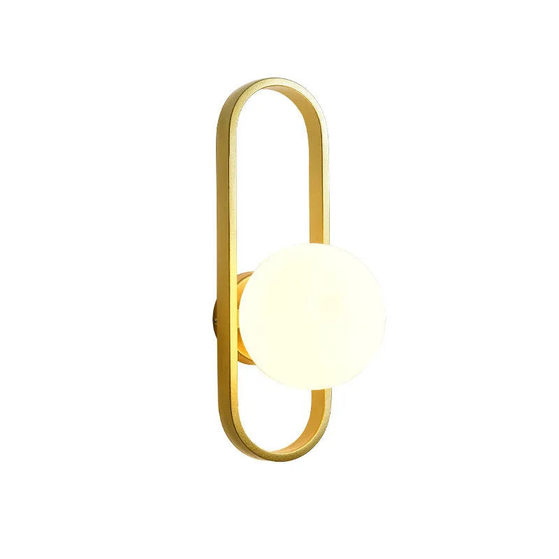 Modern minimalist wall lamp with glass shade and iron body in black or gold finish.