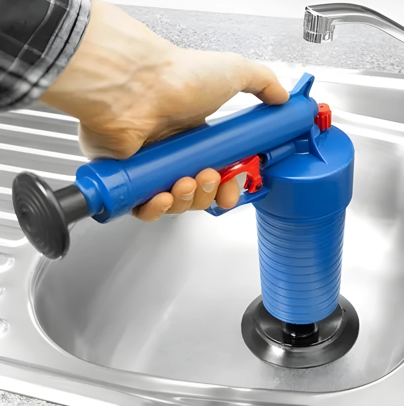 Plastic manual air pressure drain blaster gun with four different sized rubber adaptors for unblocking pipes.
