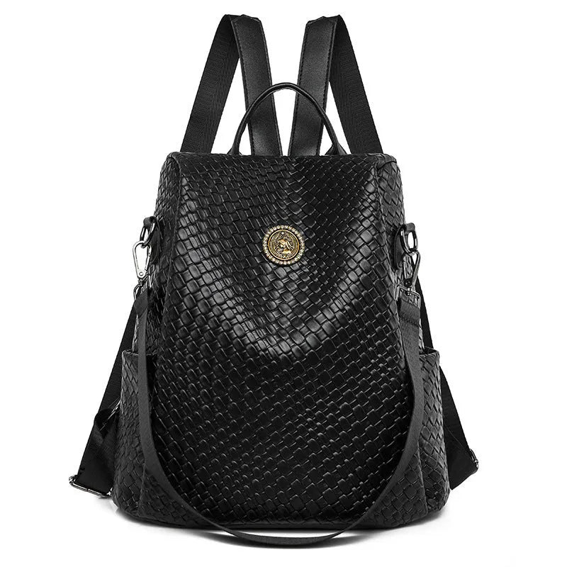 Women's black anti-theft backpack with woven detailing and multiple zipped compartments.