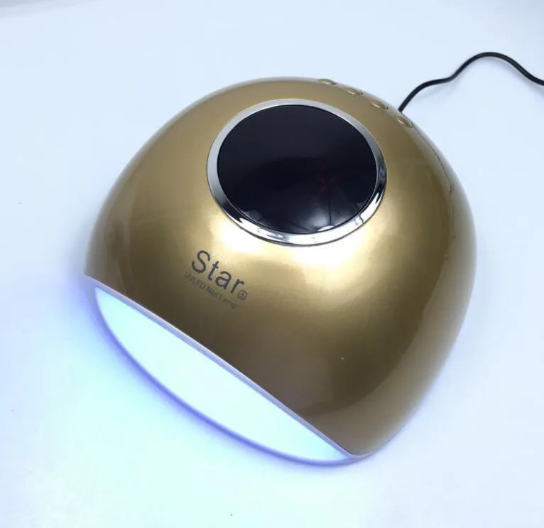 Gold acrylic number 5 LED light-up centrepiece on a table with remote control.