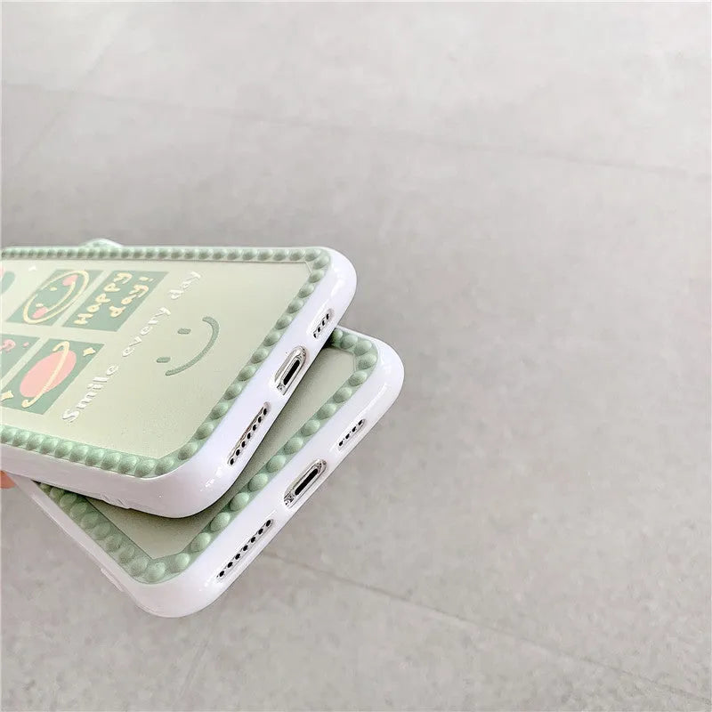 Green iPhone case with geometric shapes and smiley face pattern, TPU back cover.