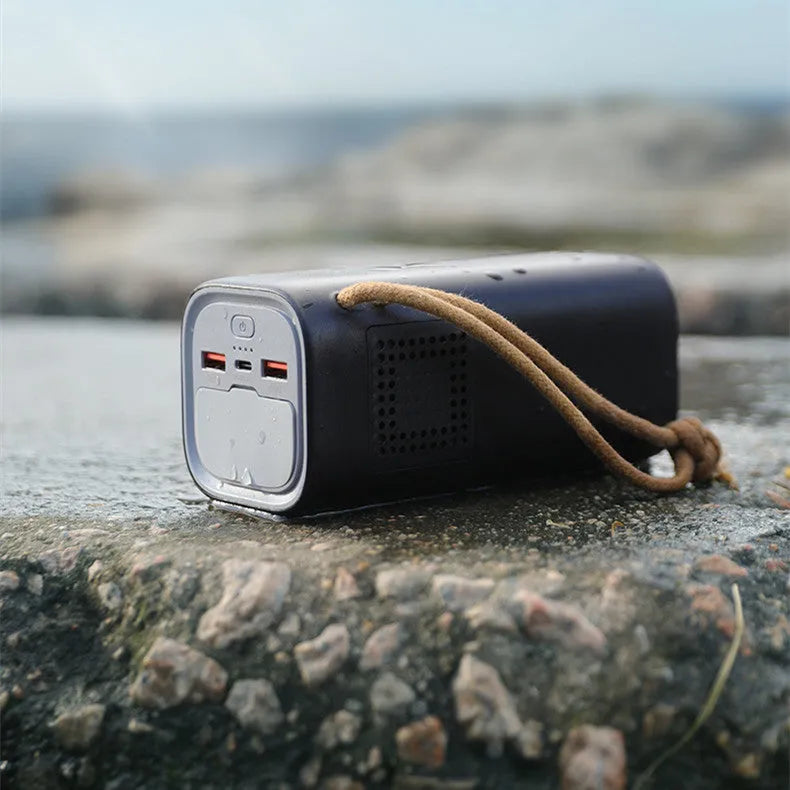 Black portable power bank with solar panel and multiple charging ports