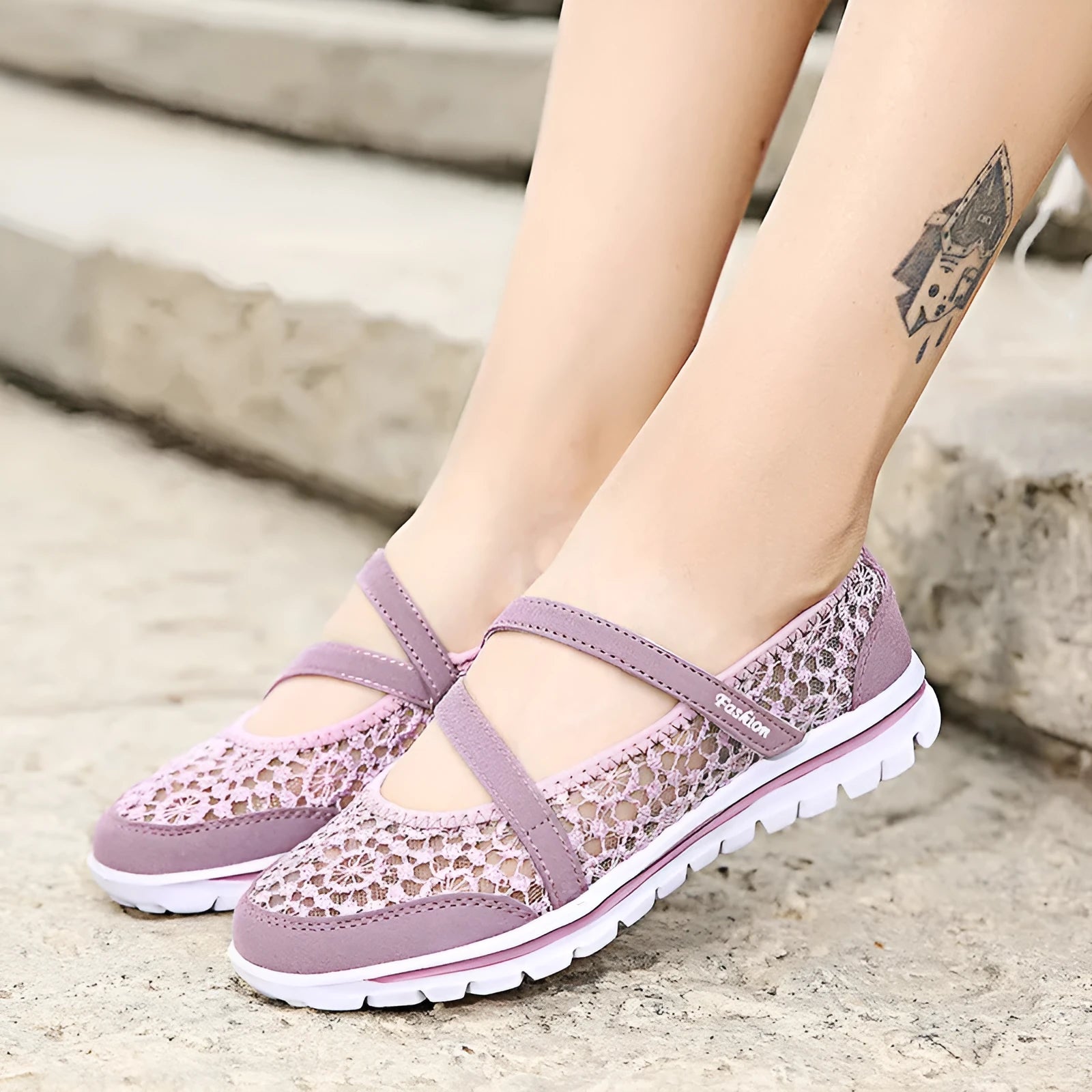 Women's flat casual shoes in beige with mesh upper and round toe, shown from the side.