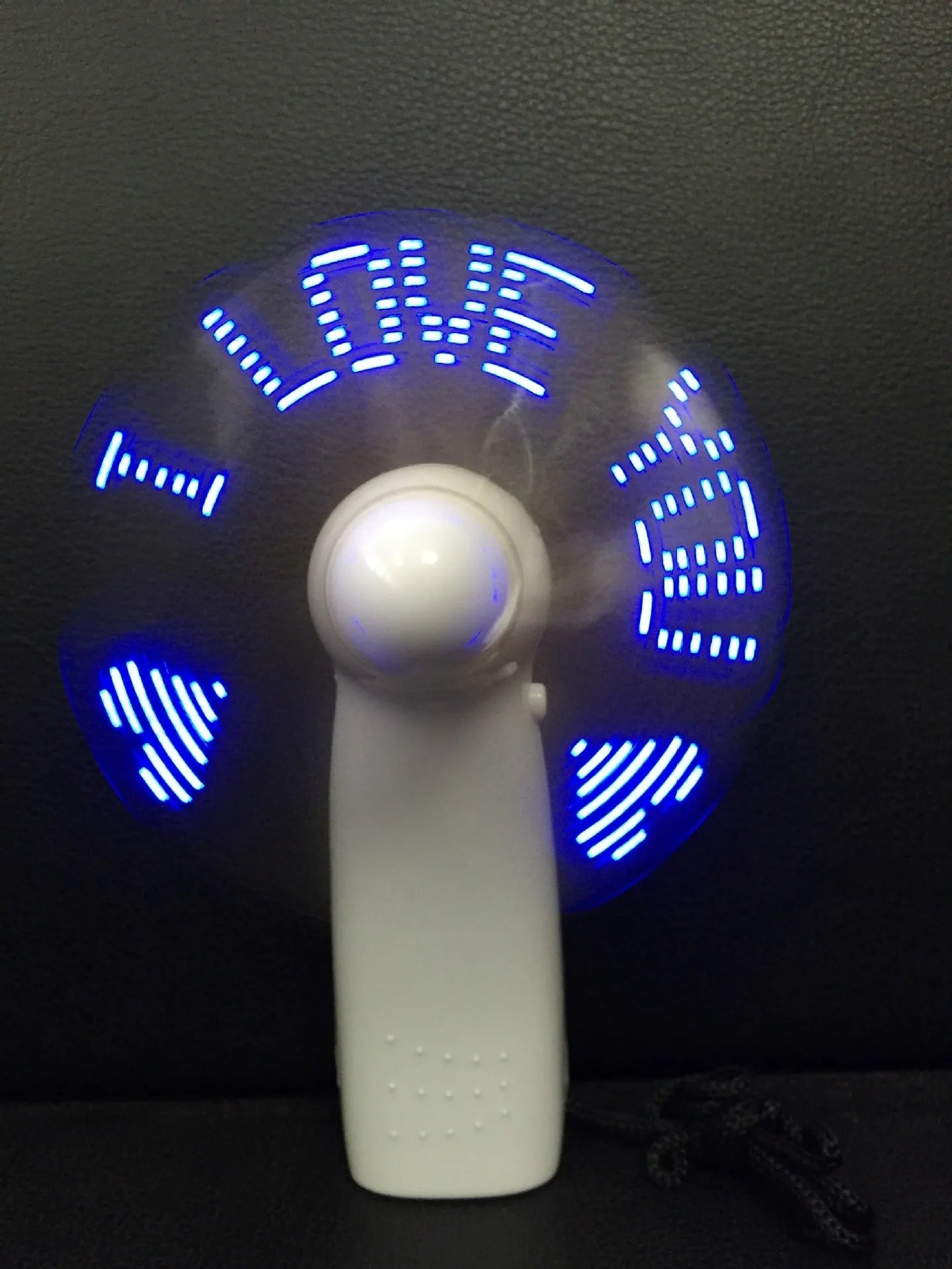 White handheld mini fan with flashing blue and red 'I Love You' LED display