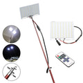 White LED fishing rod light with telescopic pole extended, showing remote control