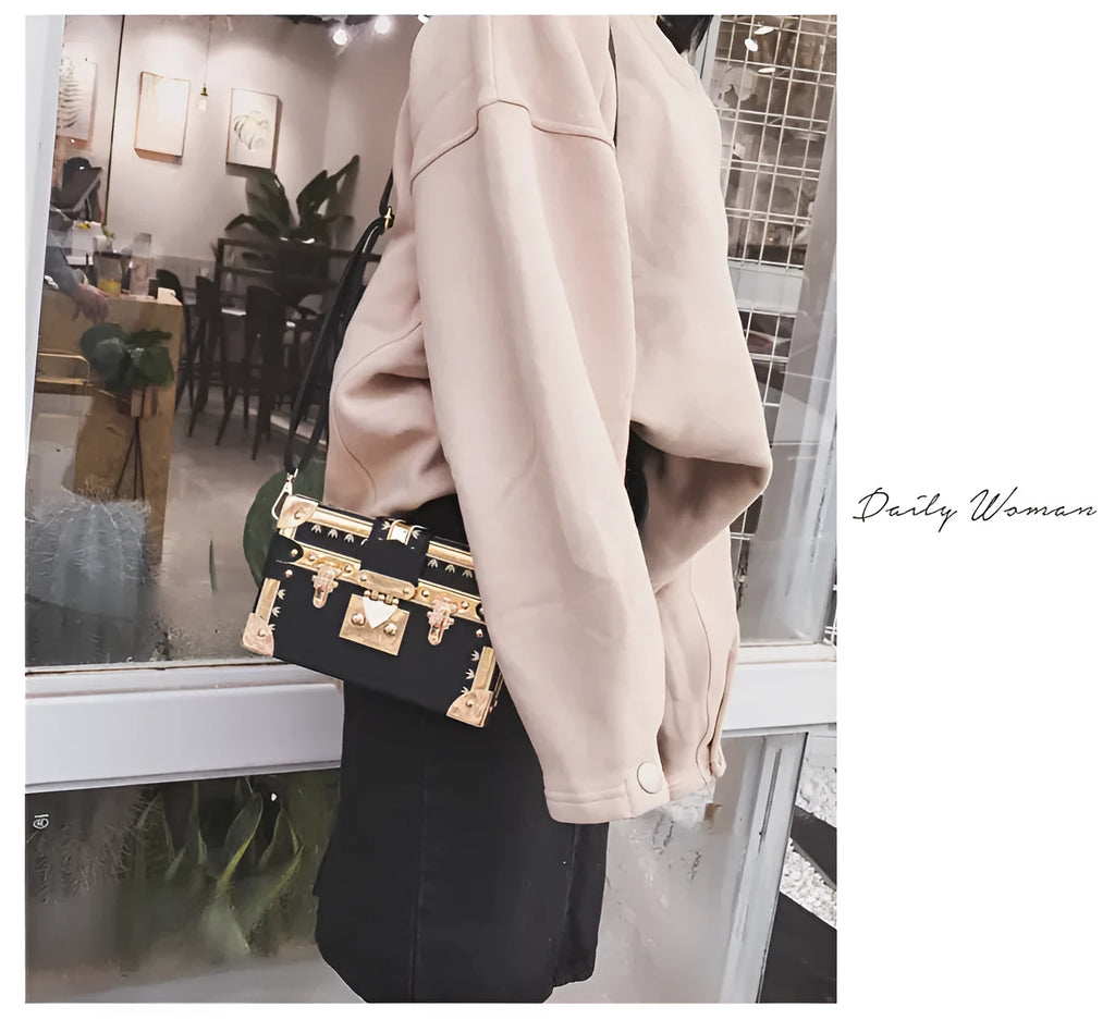 Women's hard black PU leather shoulder bag with flap closure and rivet decoration